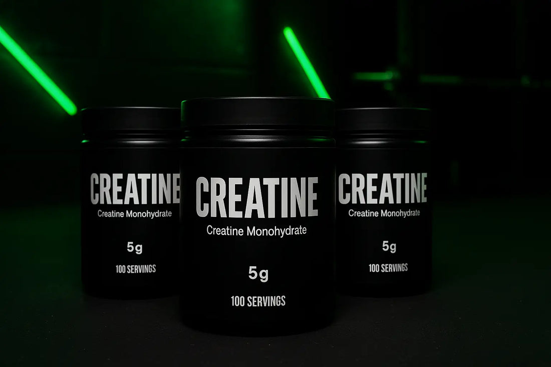 Three black supplement tubs in a moody gym setting with lime green lighting accents and blurred workout equipment in the background, styled to match MyGymSupplements’ green and black branding for the Inside the Scoop creatine feature