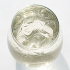 Silver ring with intricate design on a white background