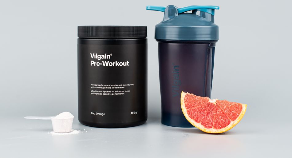 Vilgain Pre-Workout 2.0 black tub with powder scoop, shaker, and grapefruit slice