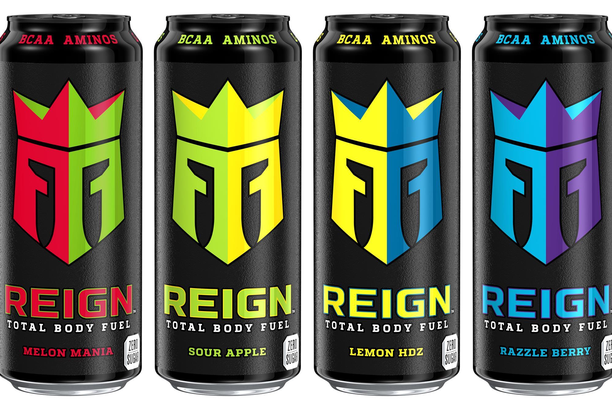 Four tall REIGN Total Body Fuel cans with colorful crown logos, muscle recovery supports