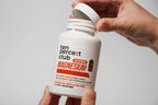 White bottle of The Ten Percent Club Super Magnesium supports bone and accelerates recovery