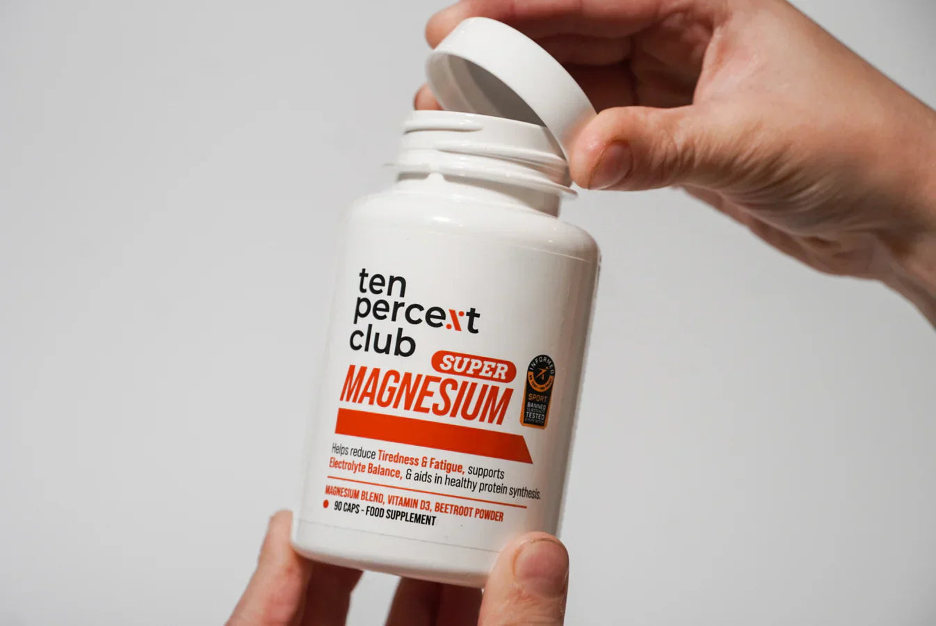 White bottle of The Ten Percent Club Super Magnesium supports bone and accelerates recovery