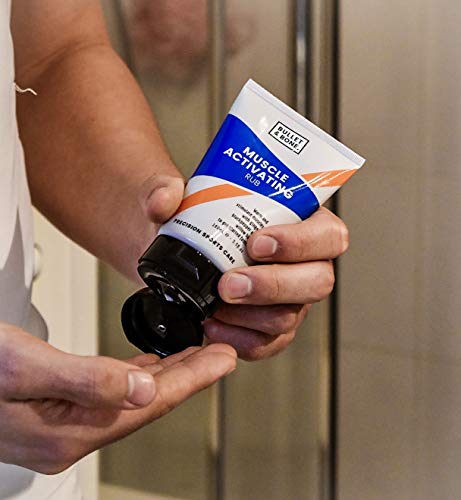 Tube of Bullet & Bone Muscle Activating Rub being squeezed into hand for powerful warming relief