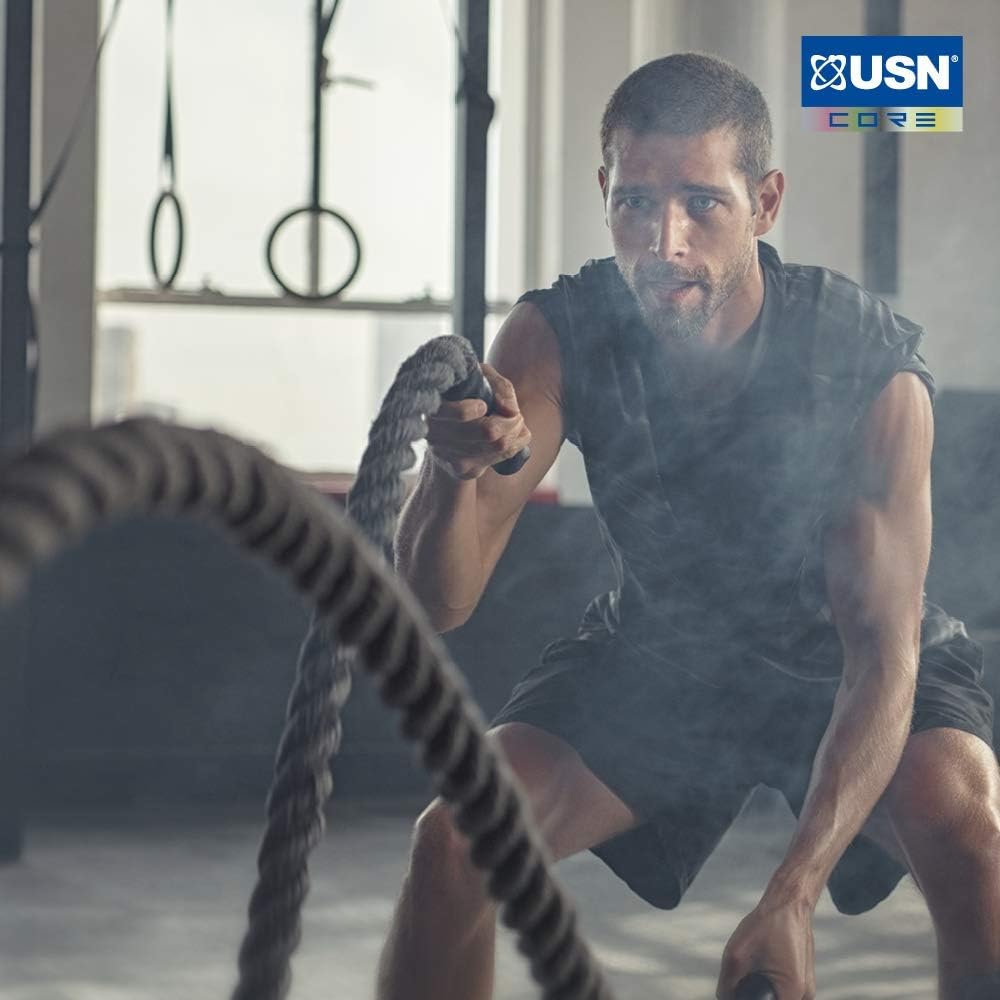 Man using USN Tornado Shaker for intense battle rope workout, leak-proof blending powders