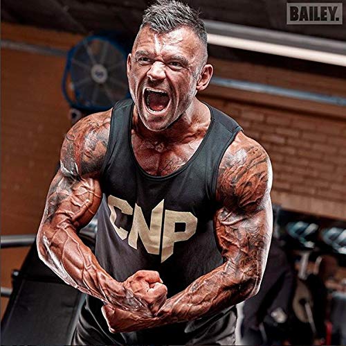 Muscular man flexing with tattoos in black tank top, promoting CNP Cyclic Dextrin energy drinks
