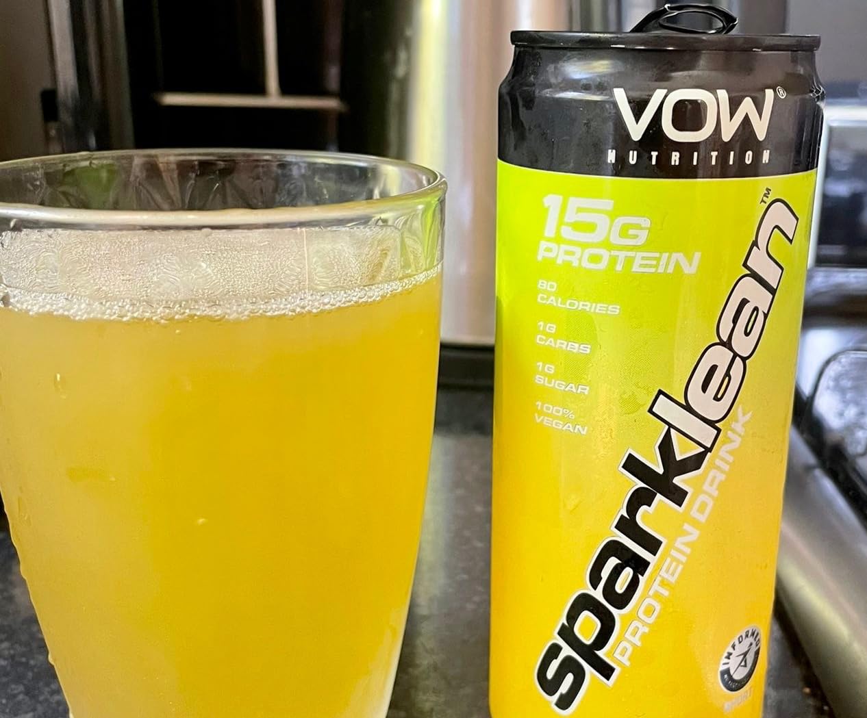 Yellow VOW Nutrition Sparklean Protein Drink in a can and glass for a high-quality vegan boost