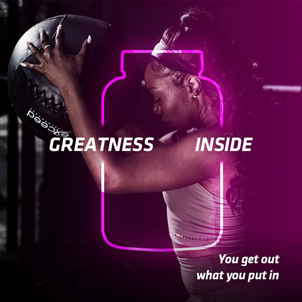 Woman in athletic wear holding a medicine ball with USN Diet Fuel Ultralean for high protein calorie control