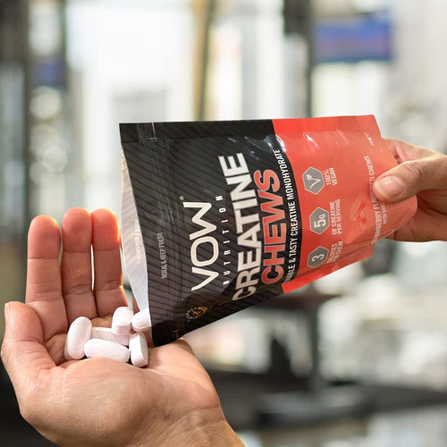 Person holding vow nutrition creatine chewable for better physical performance