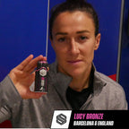 Woman holding Soccer Supplement Focus Shot Caffeinated Drink with mixed berry flavor