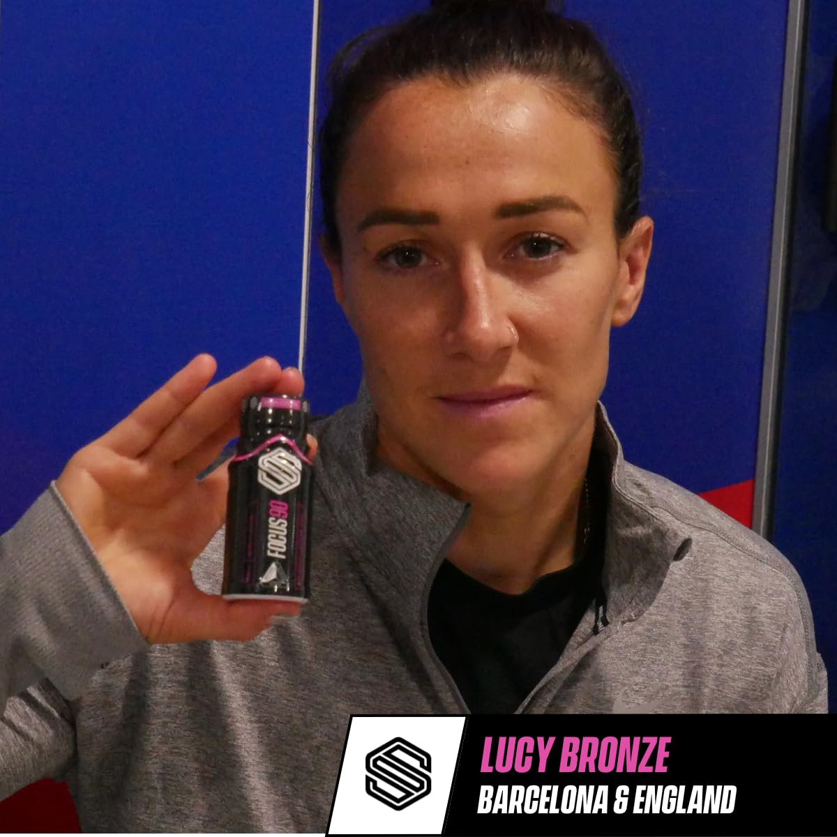 Woman holding Soccer Supplement Focus Shot Caffeinated Drink with mixed berry flavor