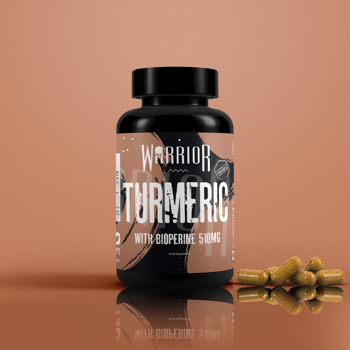 Black plastic bottle of Warrior Core Turmeric & Bioperine capsules with organic 500mg turmeric and 10mg Bioperine