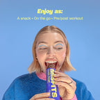 Woman enjoying a Misfits Plant-Based Protein Bar, healthy plant-based protein snack