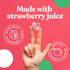 Pink cat-shaped gummy candy from Candy Kittens 10x140g Wanderlust held between fingers