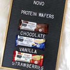Three Novo Protein Wafer Bars in chocolate, vanilla, and strawberry flavors