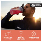 Man drinking pink vegan protein with naturally occurring BCAAs for muscle growth
