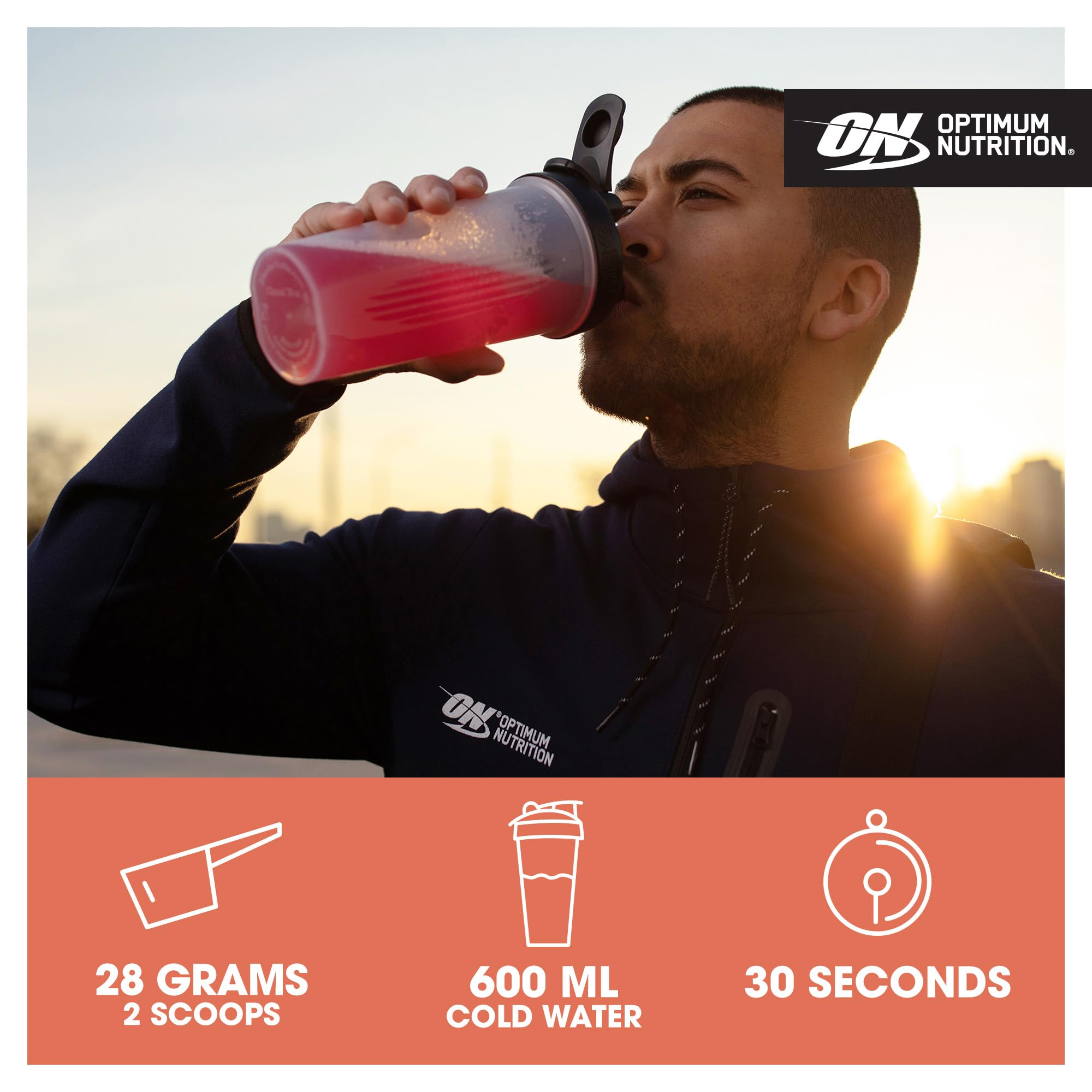 Man drinking pink vegan protein with naturally occurring BCAAs for muscle growth