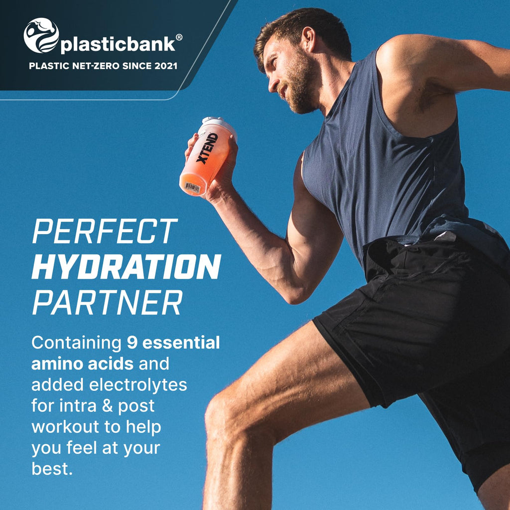 Man in athletic wear holding an orange XTEND EAAS protein shaker for workout boost