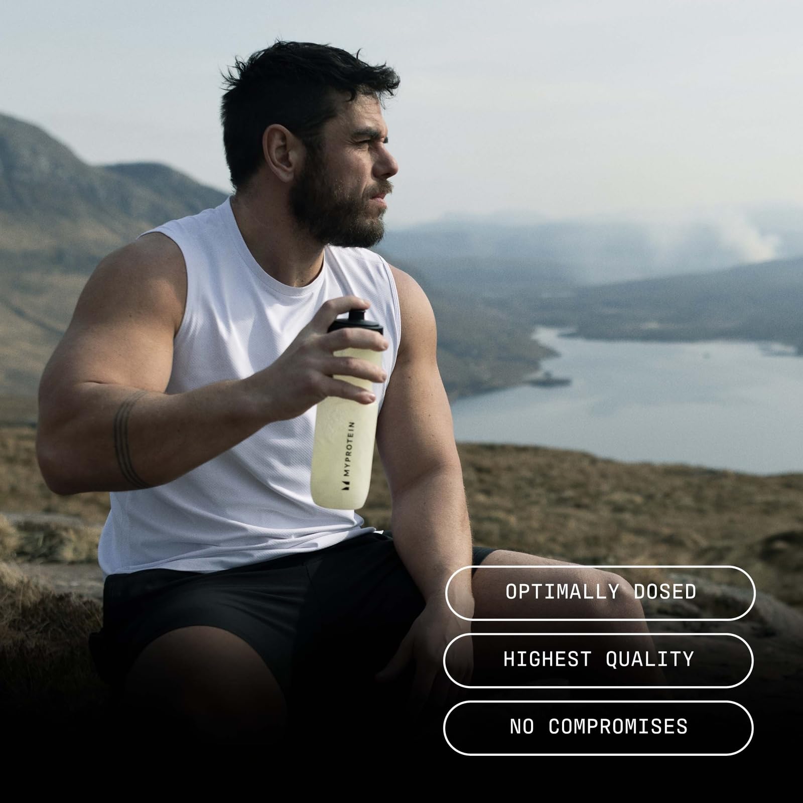 Man in athletic wear holding a MyProtein Creatine Creapure shaker for power output