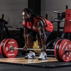 Male weightlifter doing deadlift with Scitec Nutrition Proteinissimo Prime chocolate coating