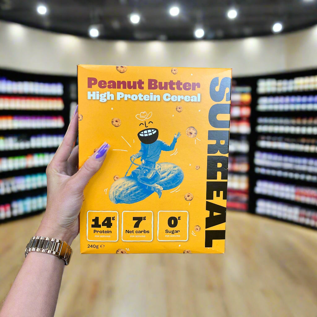 Yellow box of SURREAL Protein Cereal with nutritional info, a tasty surreal protein cereal