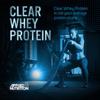 Fitness enthusiast doing battle rope exercises with Applied Nutrition Clear Whey for muscle recovery