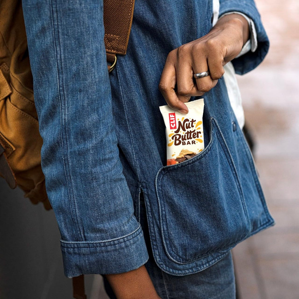 Clif Nut Butter Bar with creamy nut butter, held in denim pocket for on-the-go energy