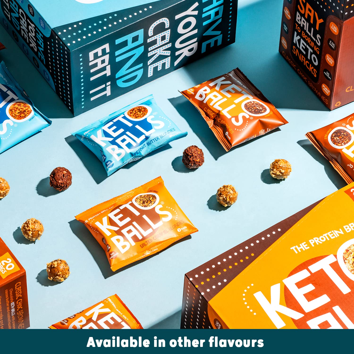 Assorted keto balls and protein balls in packets and boxes from The Protein Ball Co Keto Ball Snack
