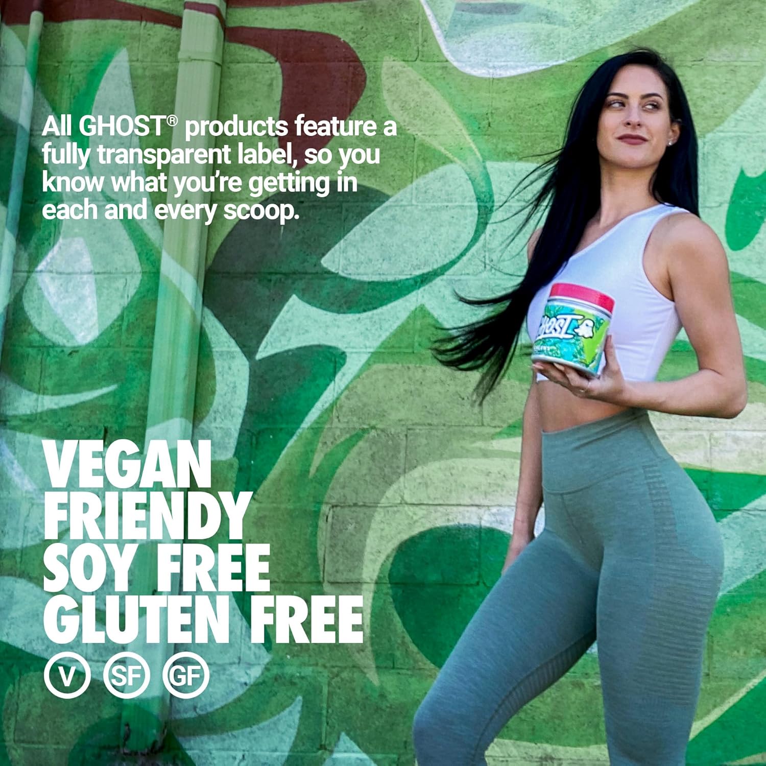 Woman holding Ghost Greens supplement tub with billion CFU and Biocore® Optimum