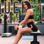 Woman with dark hair holding EHP Labs OxyShred Non-Stim fat loss supplement container