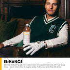 Man in green sweater vest holding Vitamin Well Enhance Orange for combat fatigue and healthy lifestyle