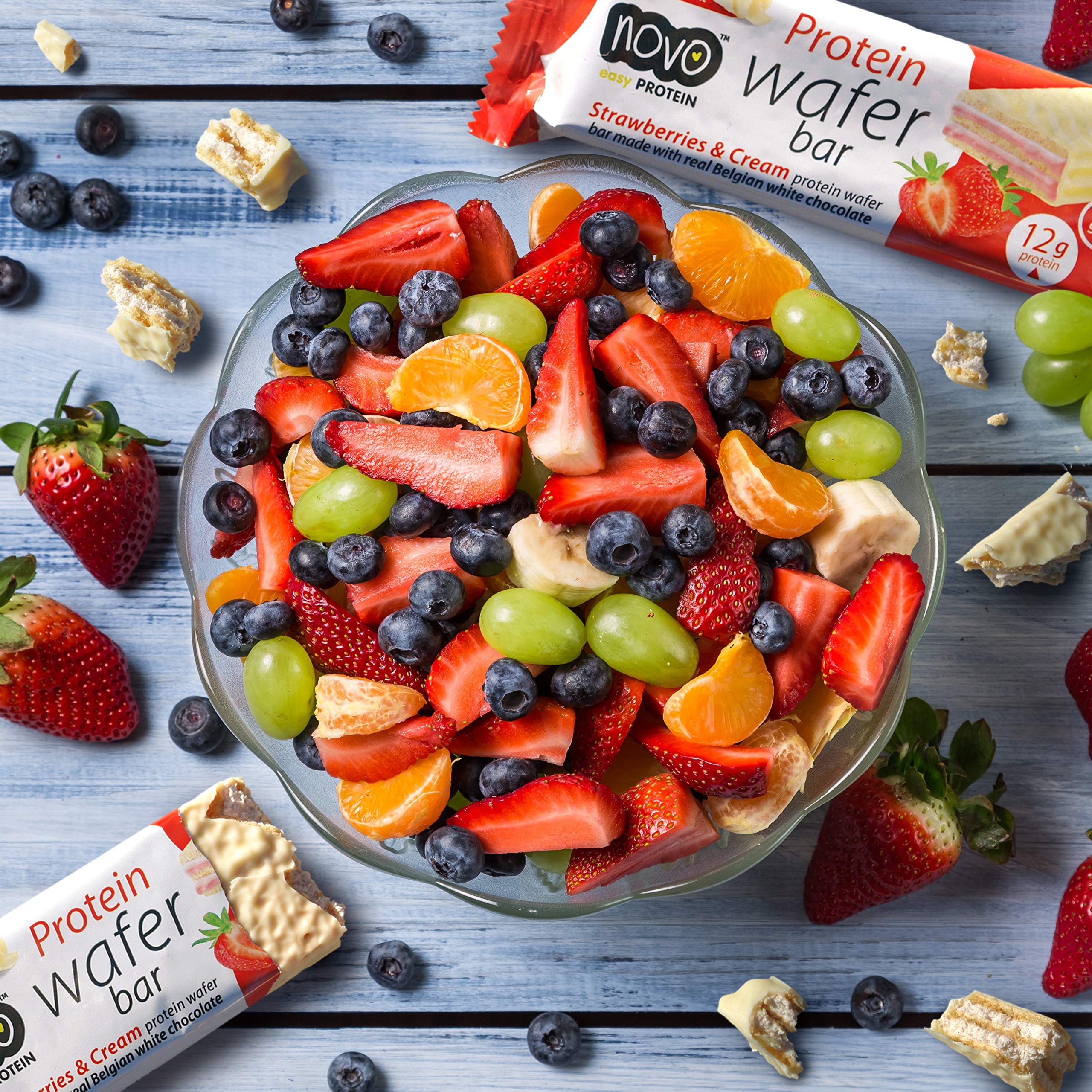 A bowl of mixed fruit salad with Novo Protein Wafer Bar for nutrition Novo Protein