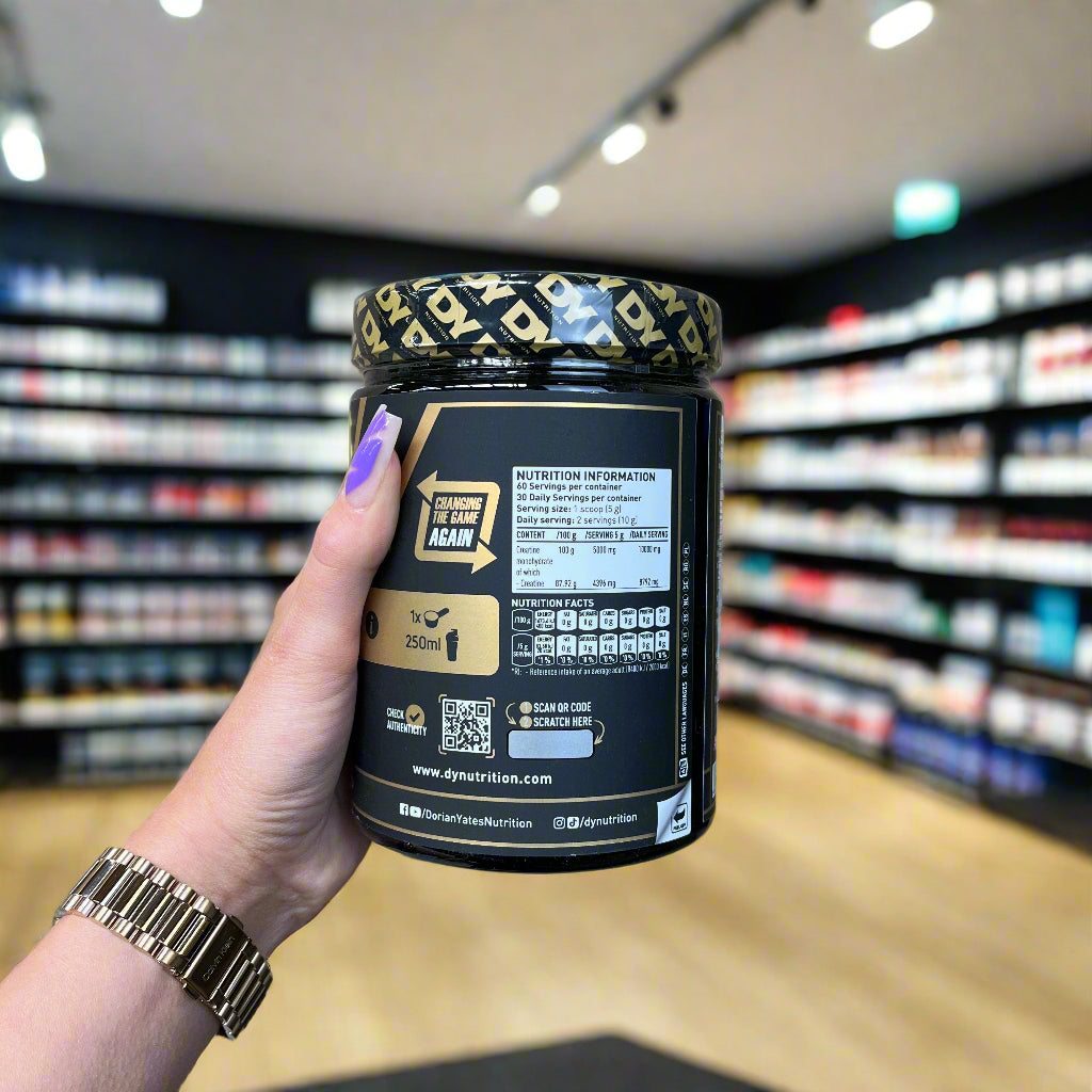 Black and gold DY Nutrition Creatine Monohydrate container for muscle growth and performance