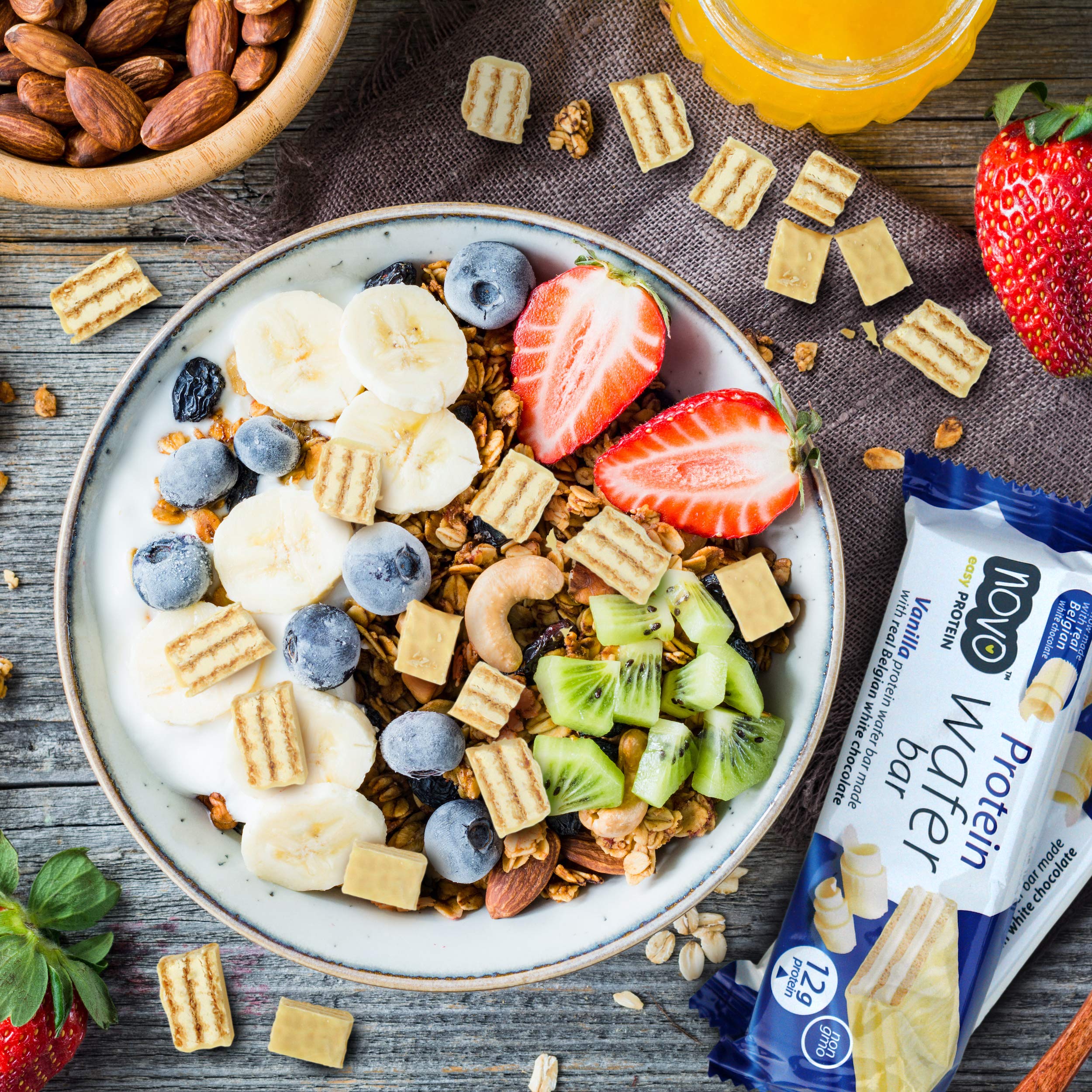 A bowl of granola with fruit and Novo Nutrition Novo Protein Wafer Bar pieces