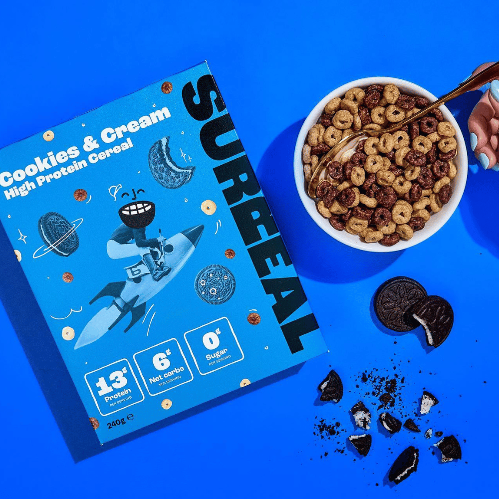 Box of Surreal Protein Cereal with high-protein, low-sugar cookies and cream flavor