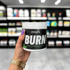 Hand holding Efectiv Nutrition Burn supplement for support fat loss and premium thermogenic formula
