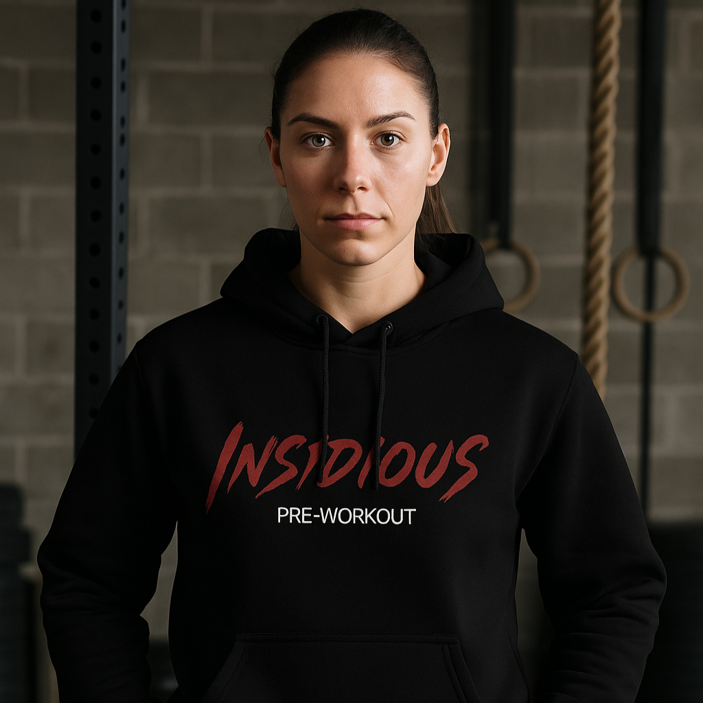 Person wearing a black hoodie with 'Insidious Pre-Workout' text in a gym setting