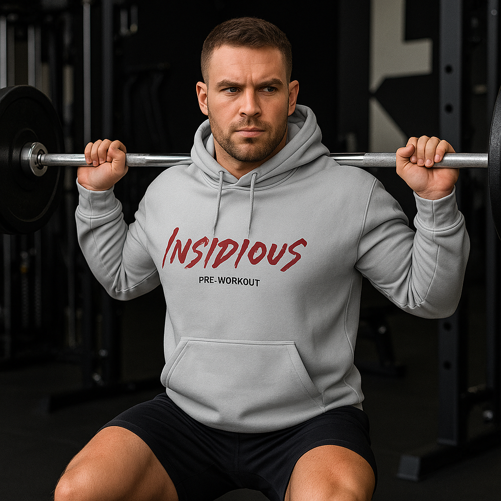 Man wearing a hoodie with 'Insidious Pre-Workout' text in a gym setting