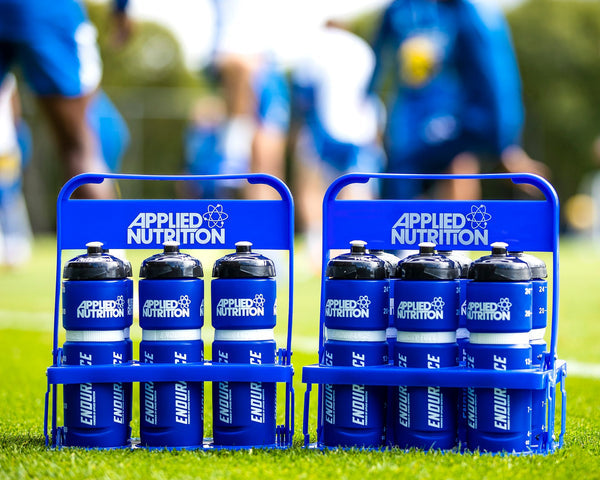 Two blue Applied Nutrition Endurance portable sports bottles carriers with six water bottles