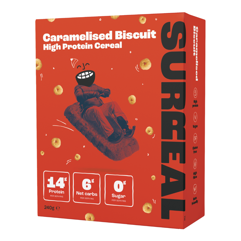 Red box of Surreal Protein Cereal with a smiling character on a sled, perfect for breakfast
