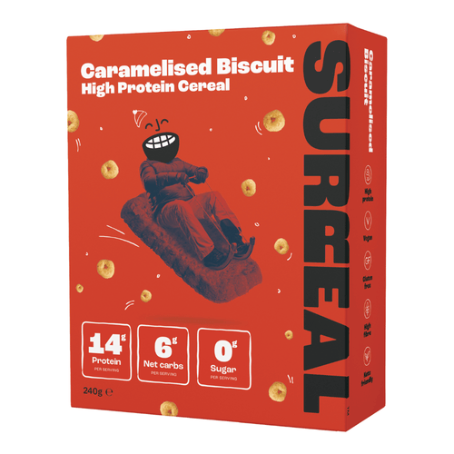 Red box of Surreal Protein Cereal with a smiling character on a sled, perfect for breakfast
