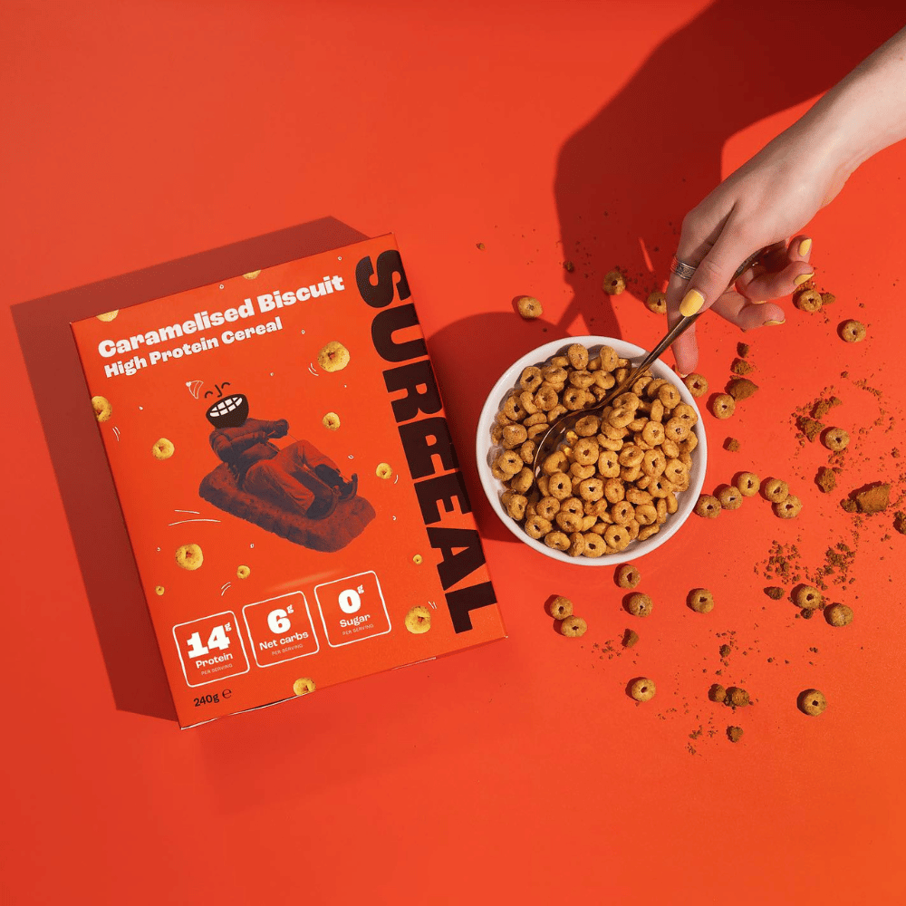 Surreal Protein Cereal box and bowl of Caramelised Biscuit High Protein Cereal