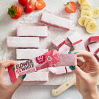 Pink Flower & White Fruity Mallow bar partially unwrapped with delicious strawberry flavor