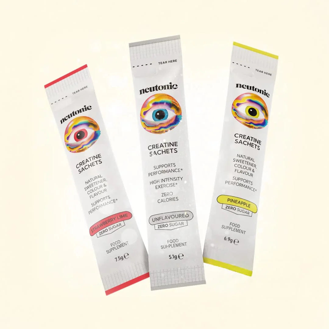 Three packets of Neutonic Creatine Sachets on a beige background