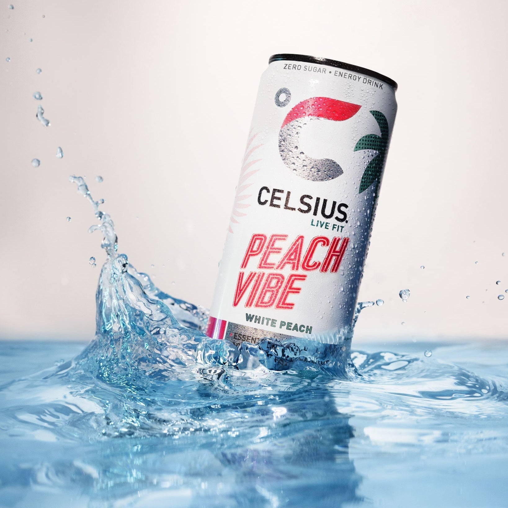 White Celsius Energy Drink can with Peach Vibe flavor for a live fitm lifestyle