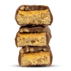 Three Per4m Protein Bars stacked with light-colored nougat and caramel filling