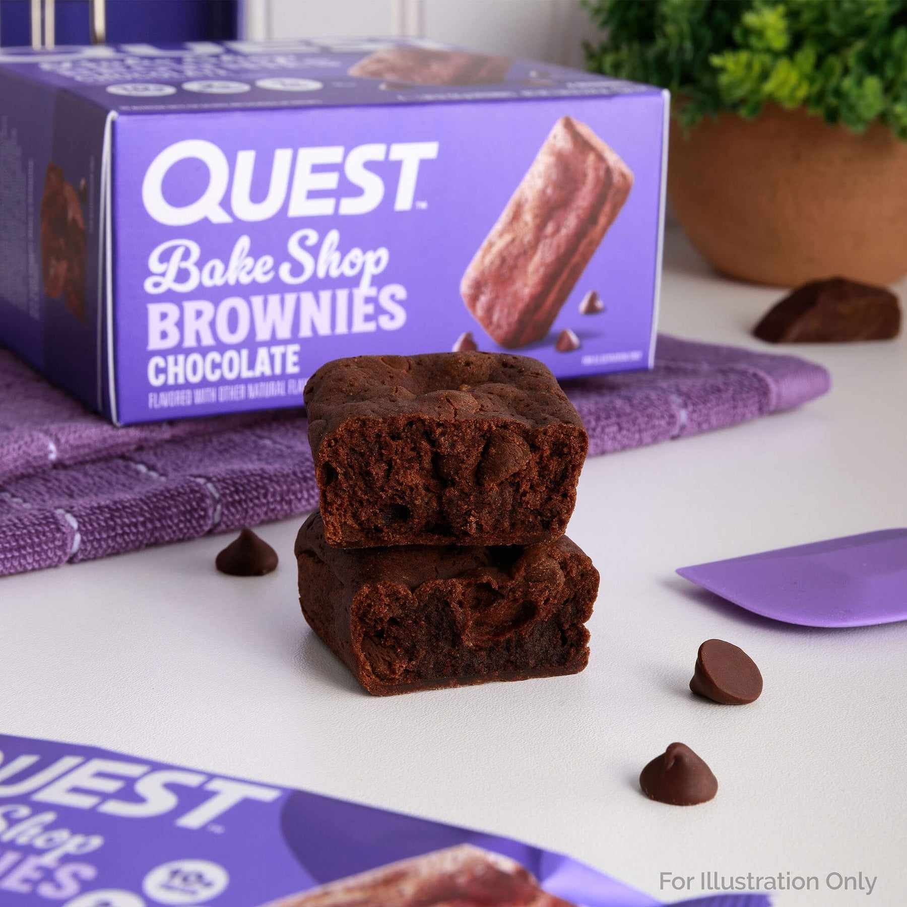 Chewy Quest Nutrition Brownie with bite mark, chocolate chips, from Quest Bake Shop