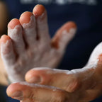 Hands coated in white chalk with AK-47 Labs Mega Grip Liquid Chalk 250ml