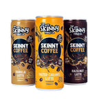 Three cans of The Skinny Food Co Skinny Coffee with vanilla, salted caramel, and hazelnut latte flavors, perfect for health-conscious coffee lovers